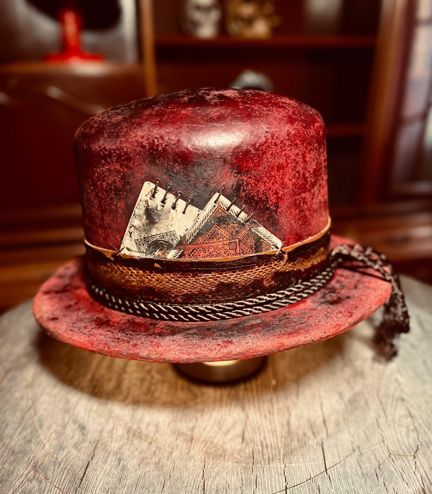 JonHats artisanal open crown hat in distressed red leather with decorative band and card accents