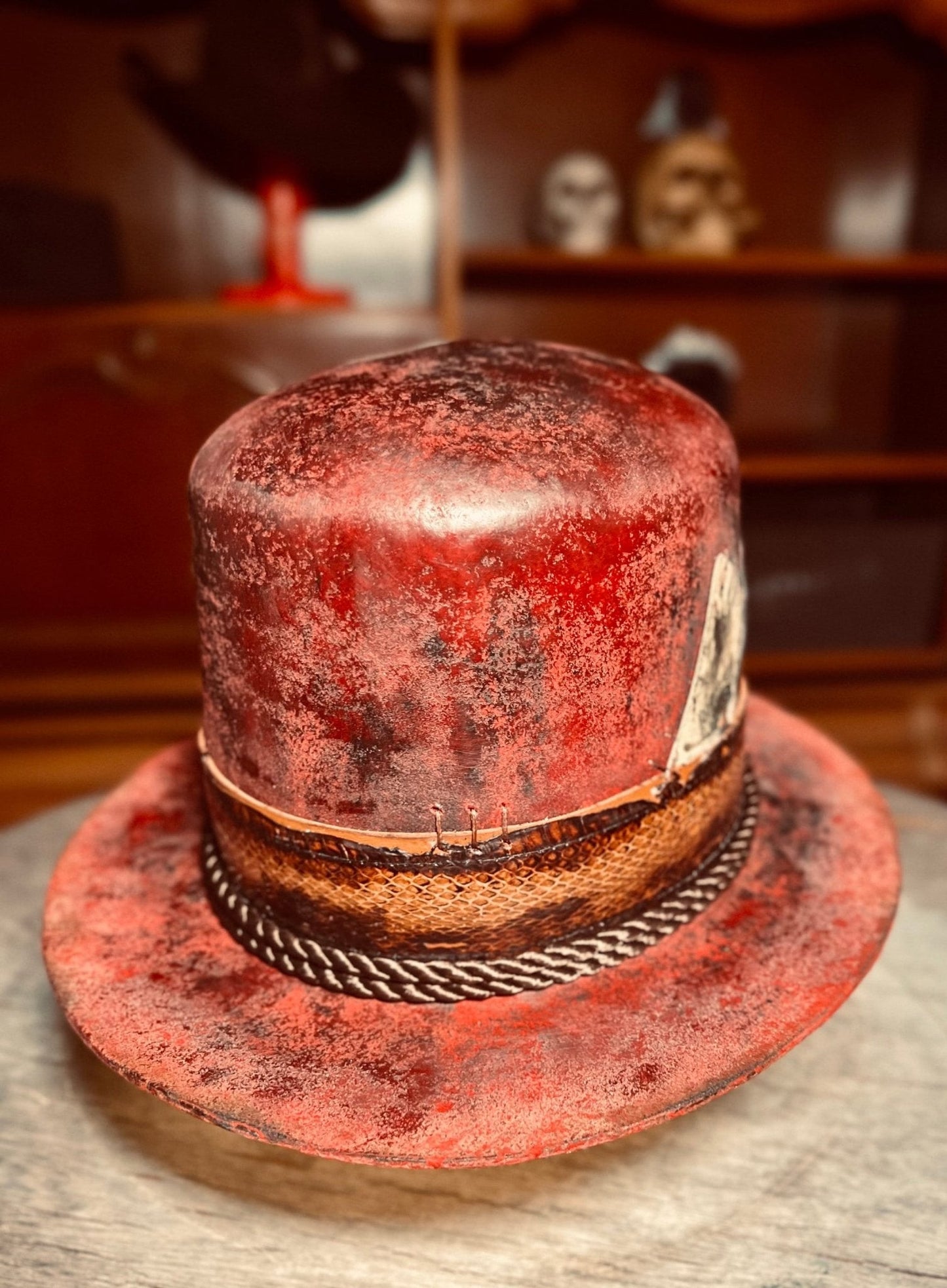 JonHats artisanal open crown hat with distressed red finish and textured brown band detail