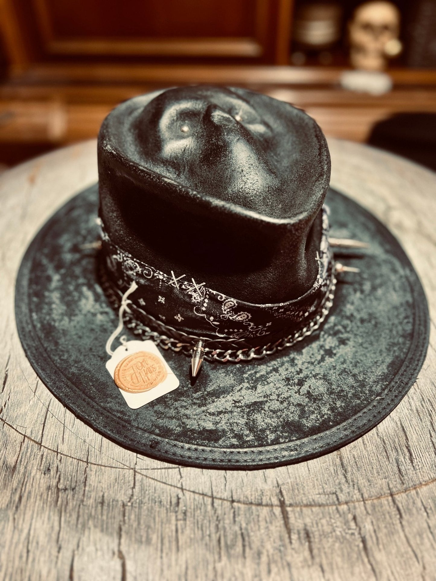 Authentic distressed skull hat by JonHats with studded band and chain detail on black leather