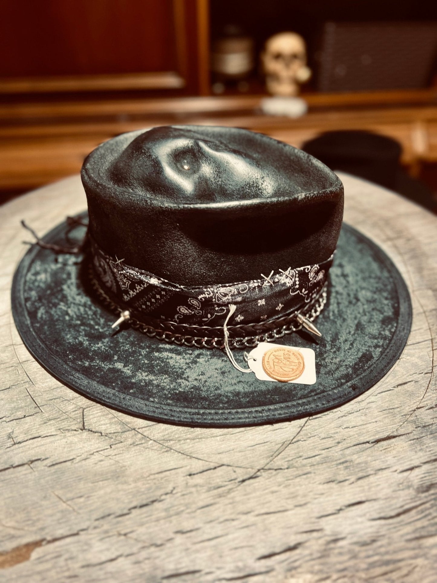 Authentic distressed skull hat by JonHats with black leather and decorative skull band