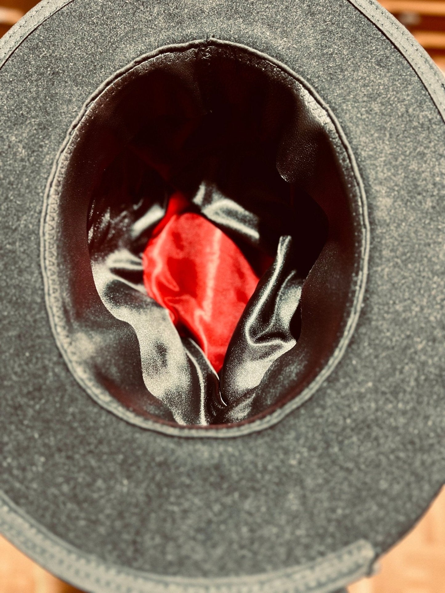 Inside view of an authentic handcrafted vintage hat by JonHats with black and red satin lining