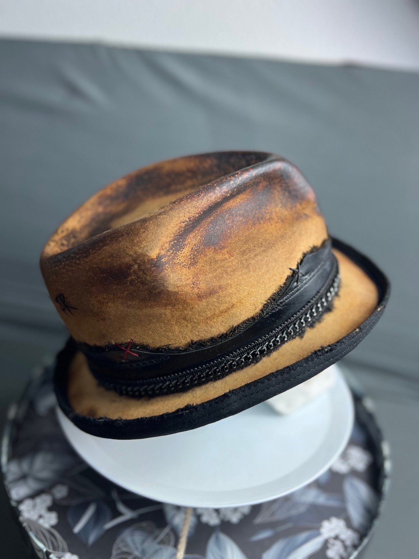 JonHats boho vintage distressed hat in brown with black trim and braided band detail