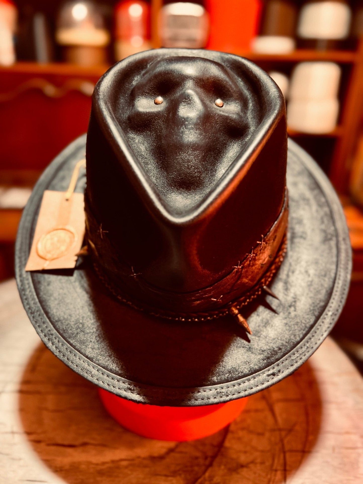 Handcrafted vintage gothic hat in black leather with skull design and spiked band by JonHats