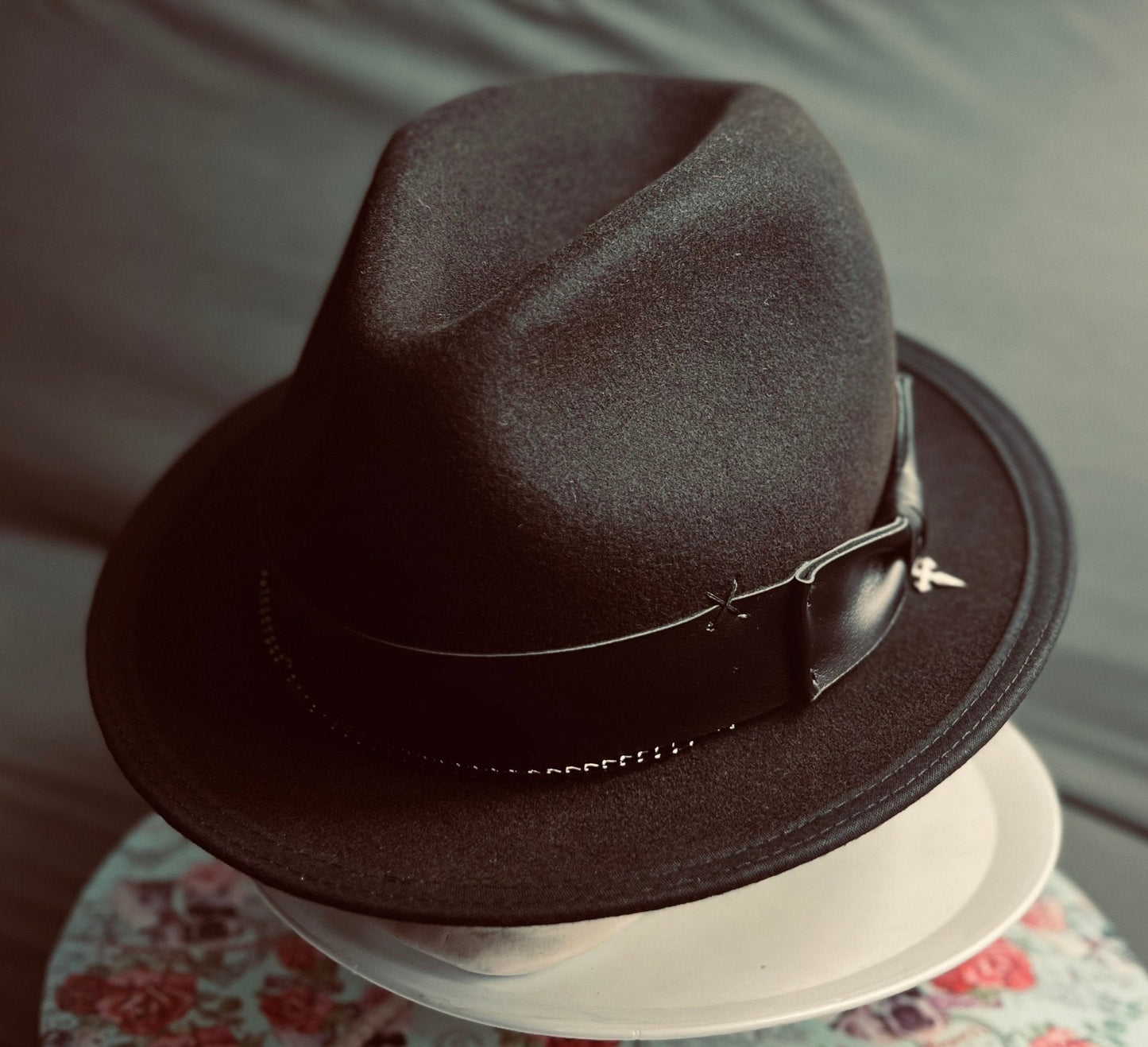 Luxury men's classic fedora in dark brown wool with black leather band and silver buckle