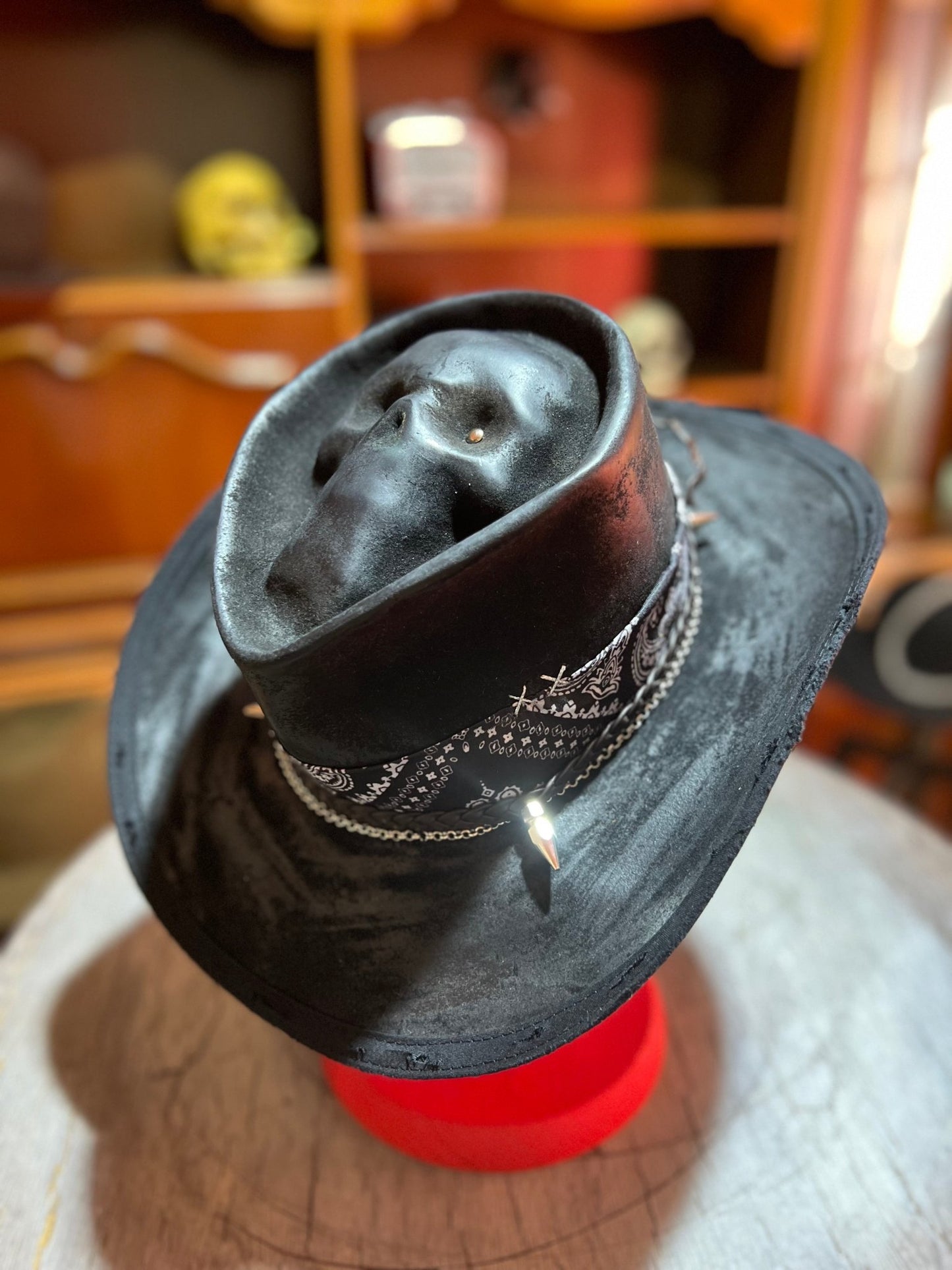 Black skull themed cowboy hat by JonHats with decorative band and skull design on crown