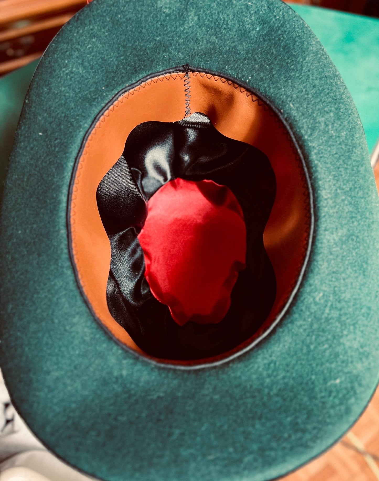 Unique handcrafted vintage hat with green felt exterior and satin-lined interior by JonHats