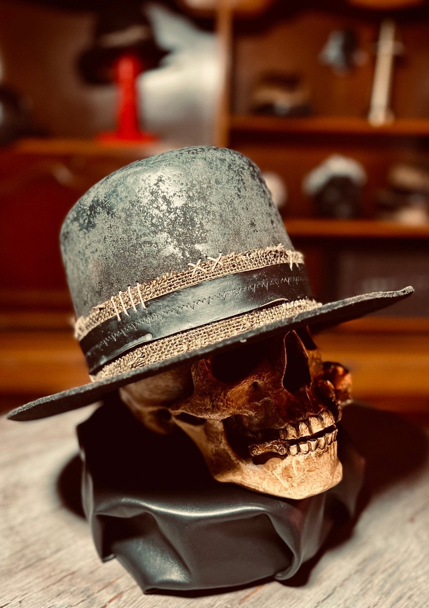 Vintage western open crown hat by JonHats displayed on a decorative skull with stitched details