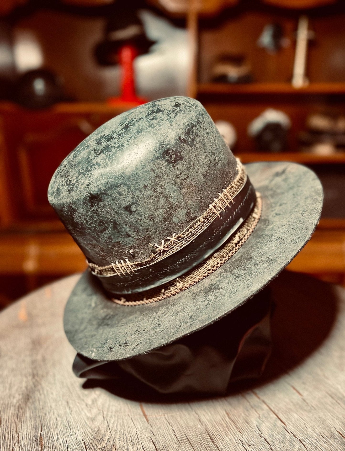 JonHats vintage western open crown hat in distressed grey with decorative stitched hatband on wooden surface