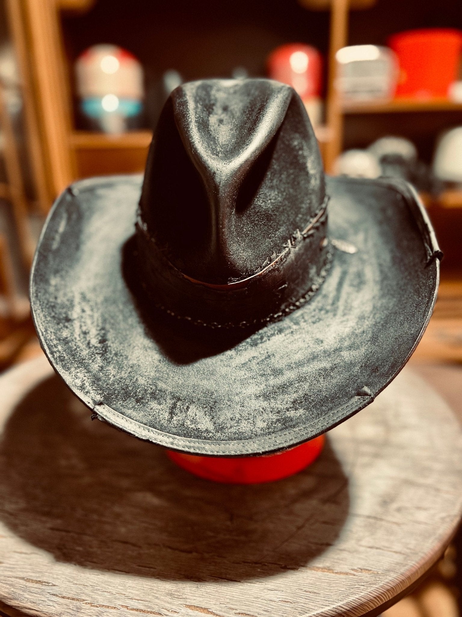Western distressed hat handmade in black leather with weathered finish and classic cowboy style