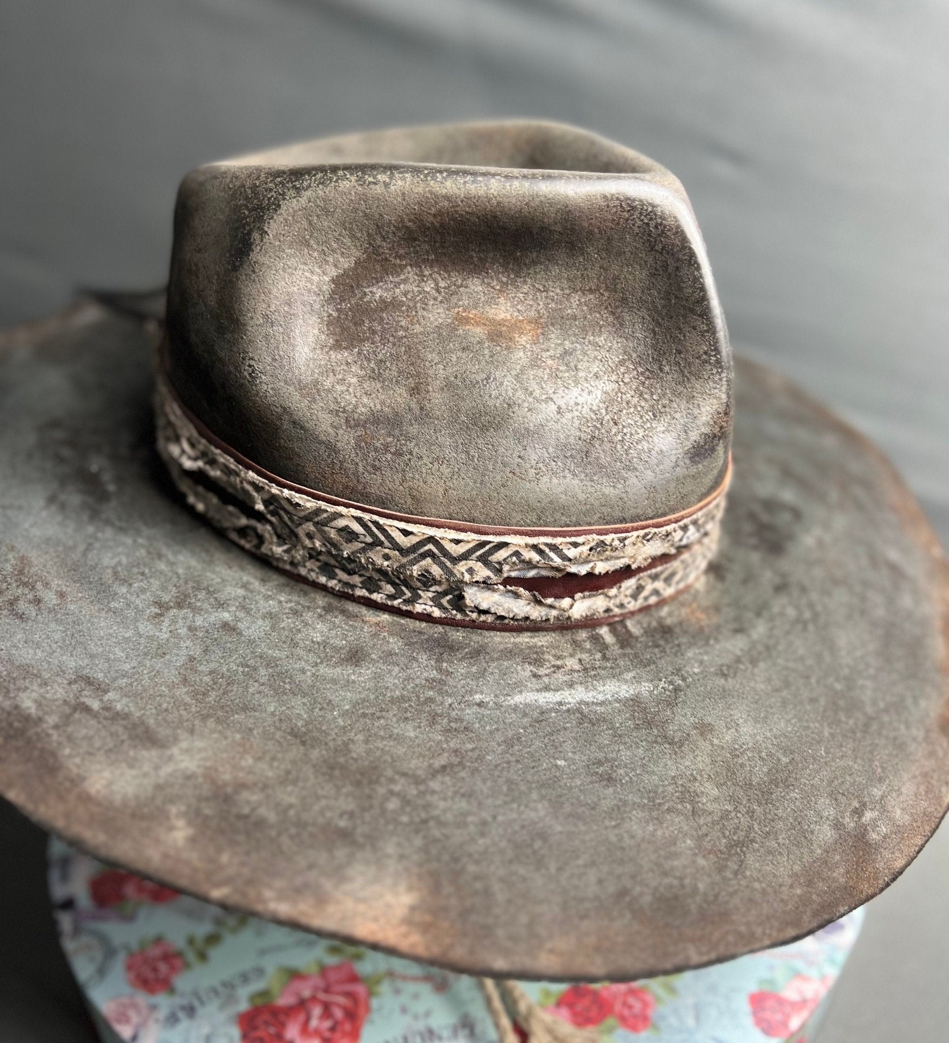 Exclusive handcrafted hats by JonHats featuring a weathered grey wide brim with patterned band