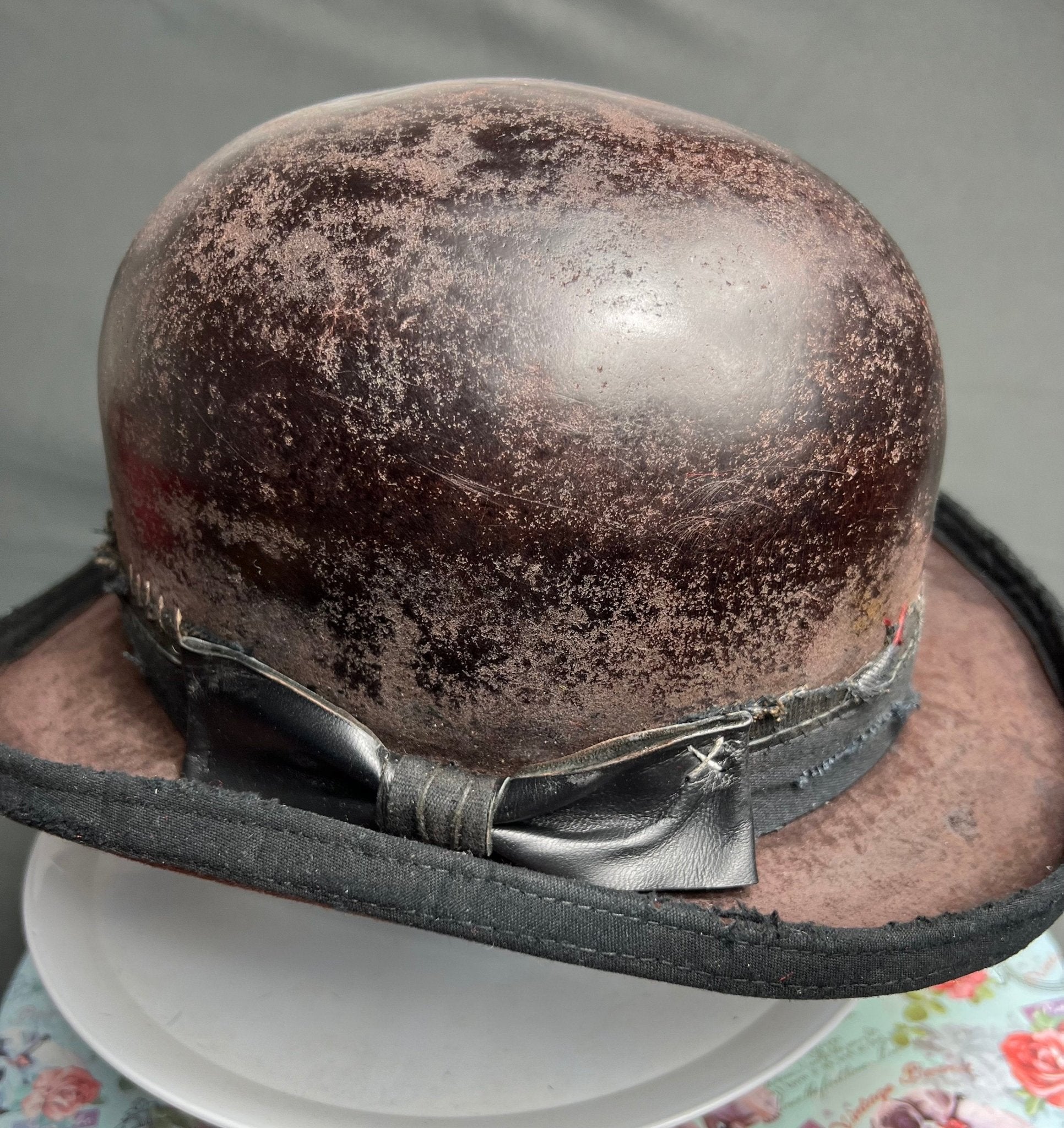 Handmade vintage bowler hat with distressed brown finish and black leather bow detail by JonHats
