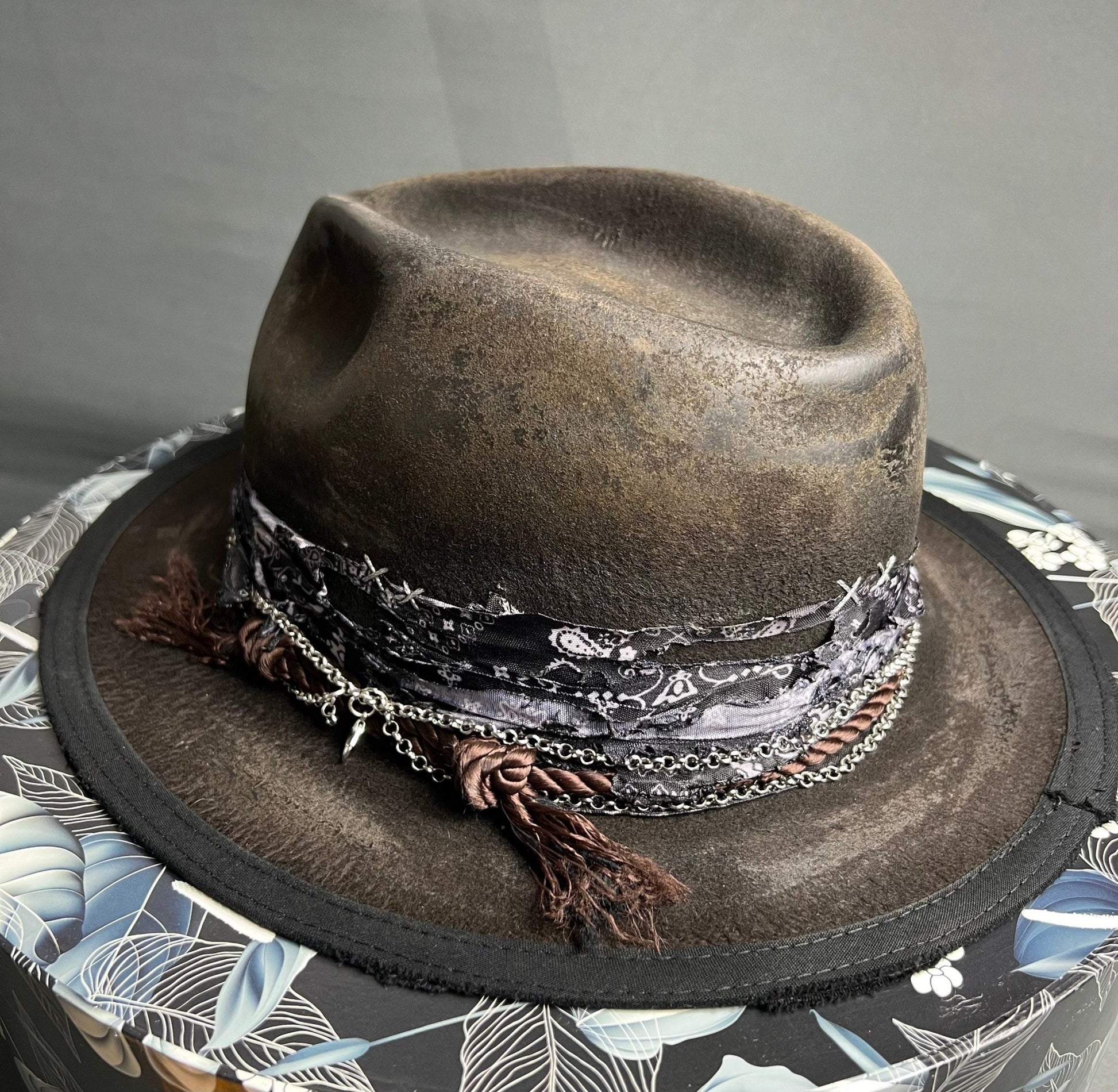 JonHats handmade vintage fedora in brown with decorative band and chain detailing on round box