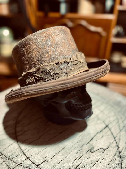 JonHats rustic handmade western hat with distressed leather band on black skull display